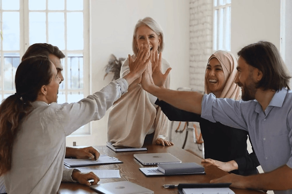 Coworkers Celebrate With a High Five