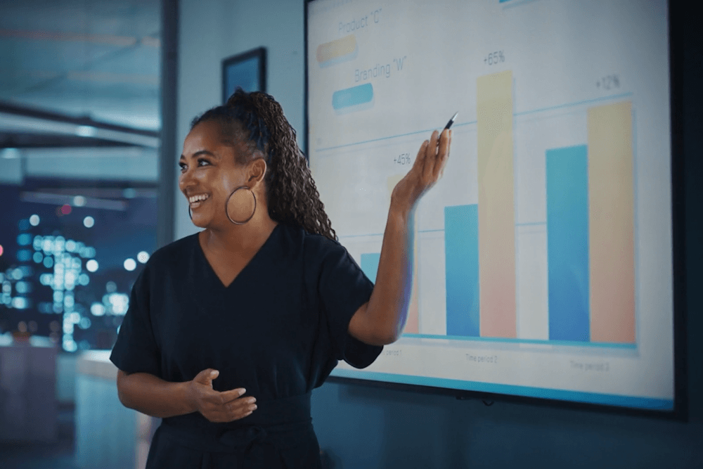 A Woman Is Giving a Presentation in a Work Setting