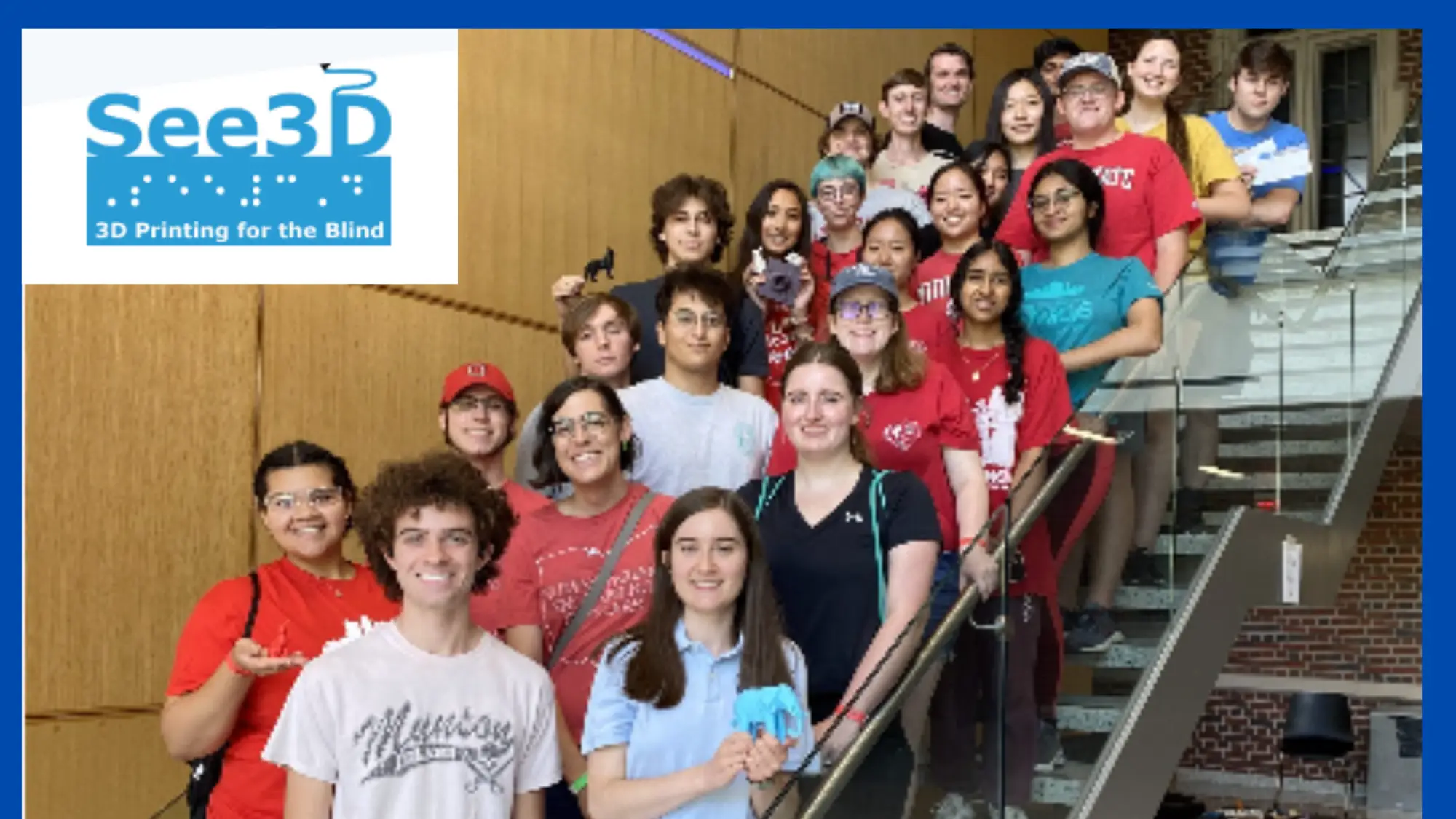 Members of See3D pose together on a staircase, some holding small 3D-printed objects. The See3D logo, with the tagline "3D Printing for the Blind," appears in the top-left corner.