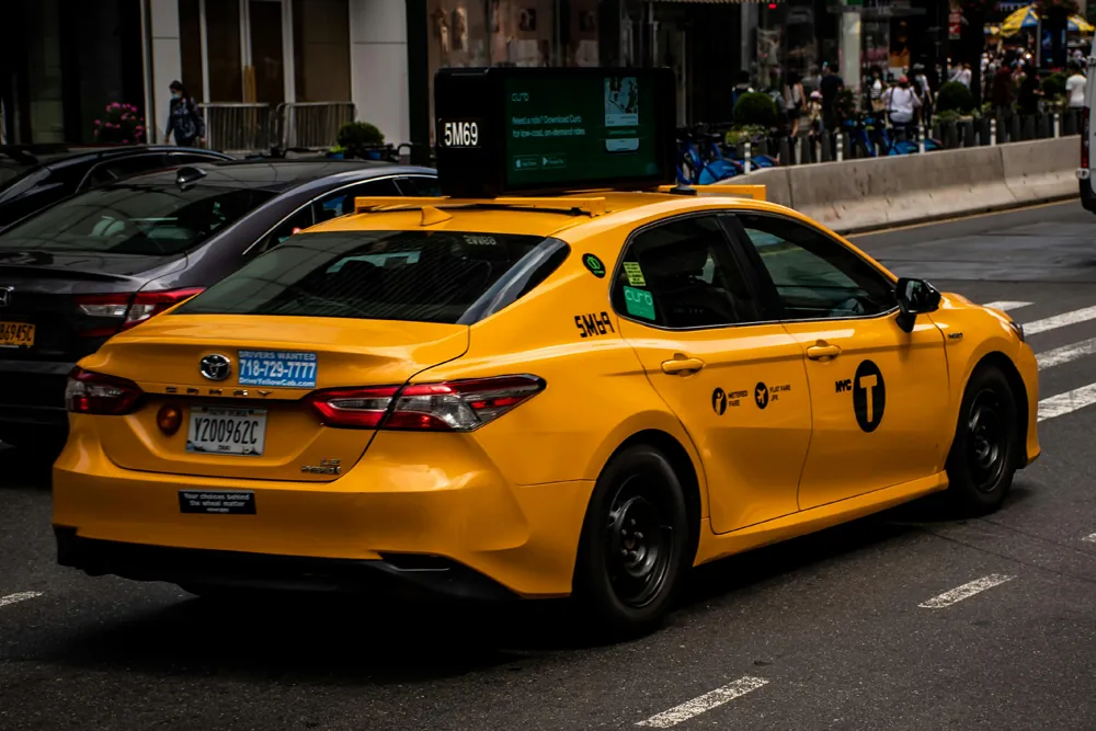 Yellow New York City taxi cab with 5MG9 identification on street