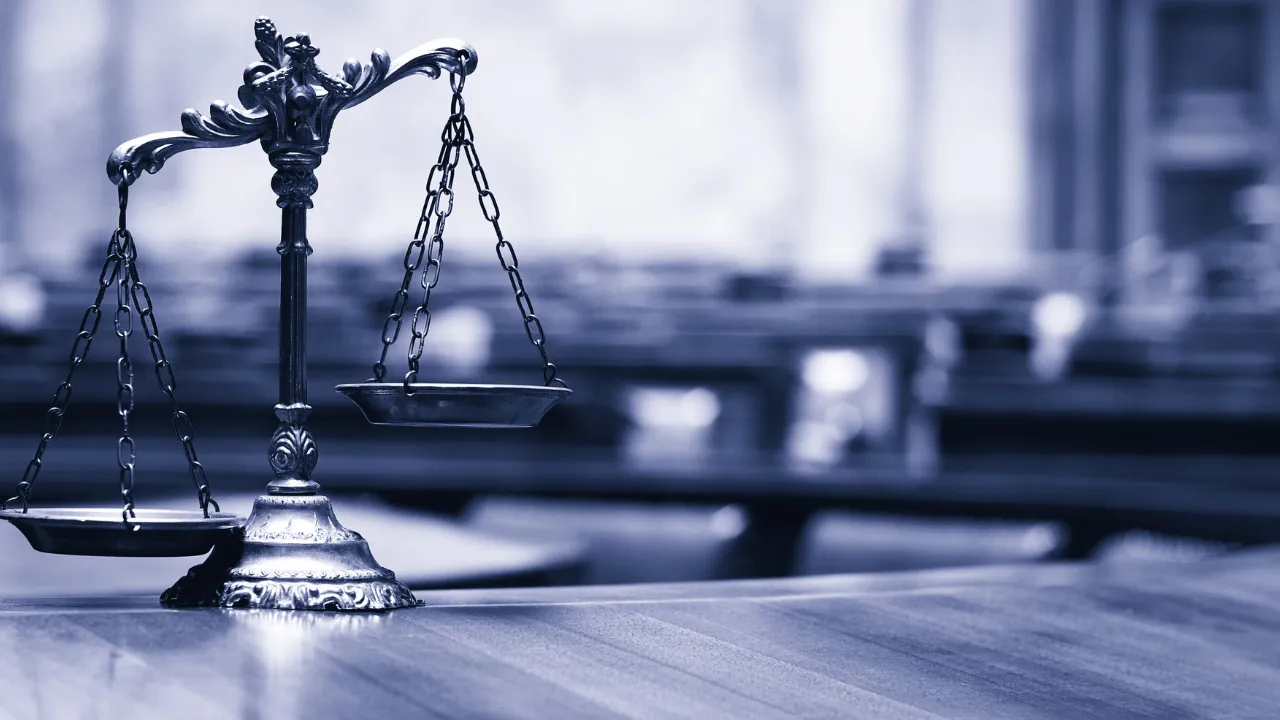 Scales of justice representing the legal battle over Section 504 protections for disabled job seekers